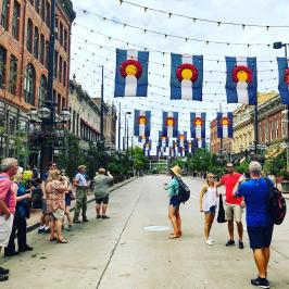 a group of people walking down the street