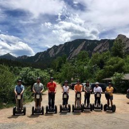 a group of people standing on top of a mountain