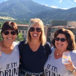 a woman holding up a mountain in the background
