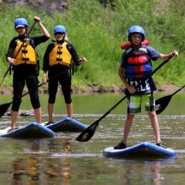 a group of people that are standing in the water